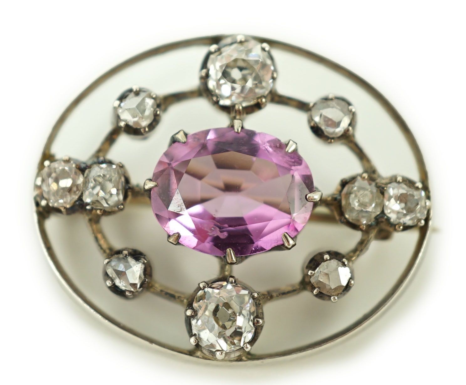 A 19th century gold and silver, pink topaz and diamond set openwork oval brooch